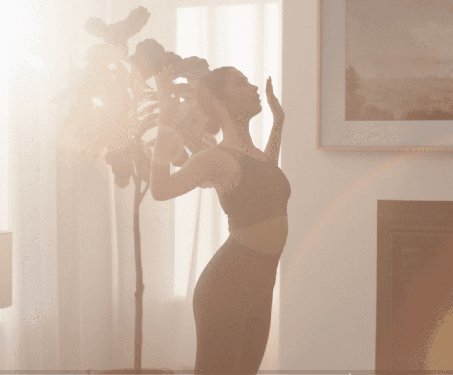 Person doing a light indoor workout in warm natural light