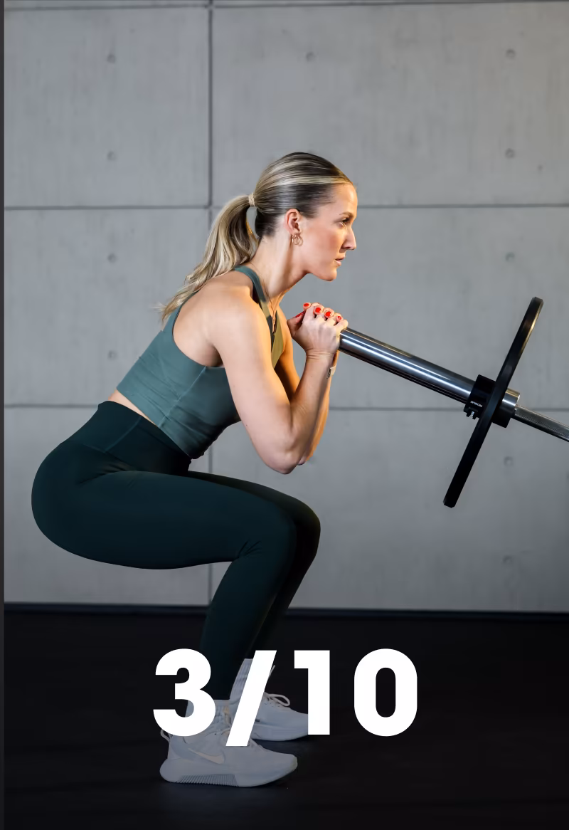 A woman squats holding the end of a barbell while the app counts 3 of 10 reps